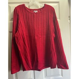 Shimmering open weaved sweater.